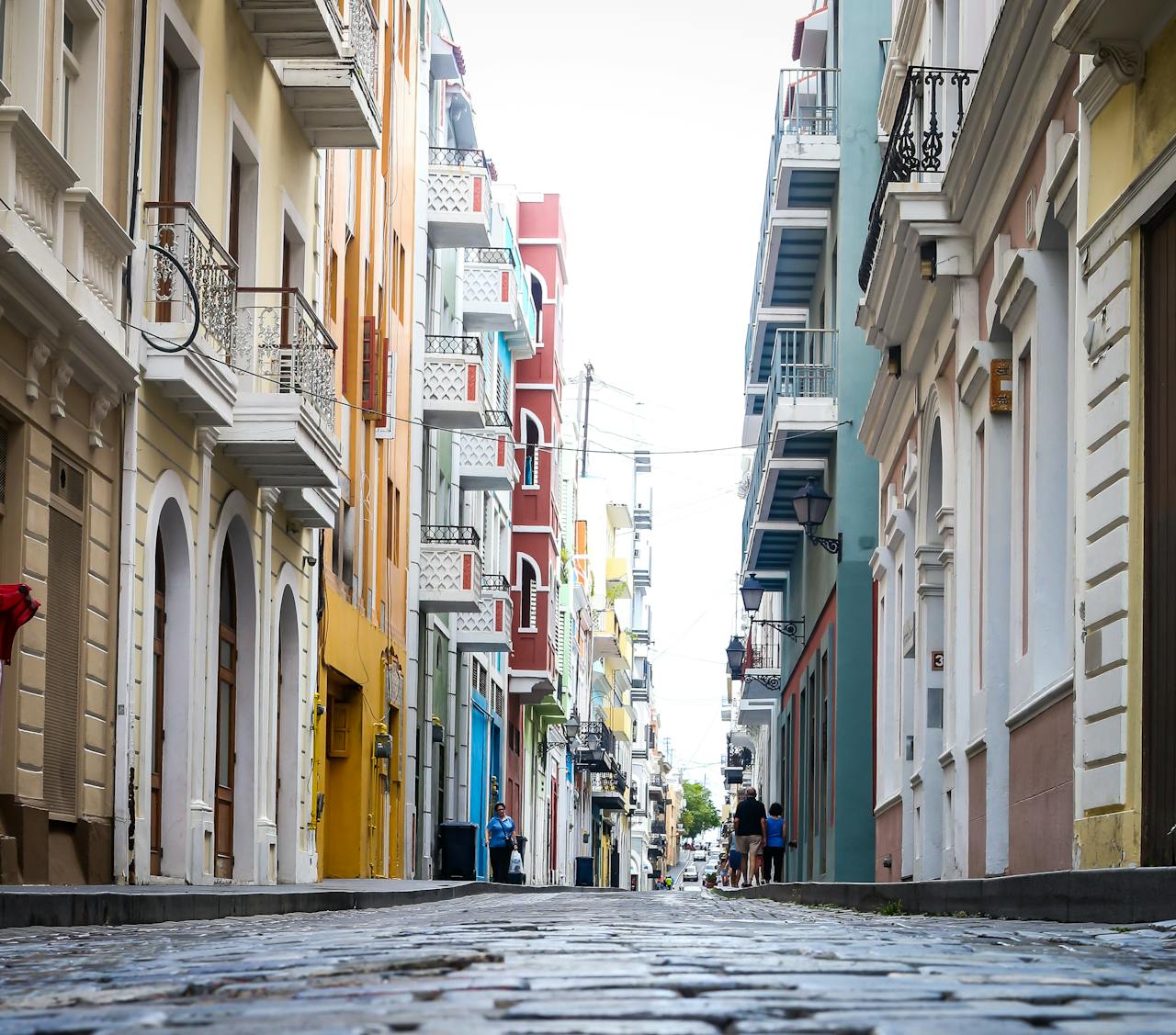 about-03 Vibrant colonial architecture lines a cobblestone street in Old San Juan, Puerto Rico.